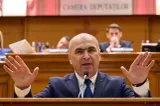 România intră într-o nouă perioadă de austeritate. Bolojan ar fi negociat cu UE un deficit mai mic: ne așteaptă noi taxe