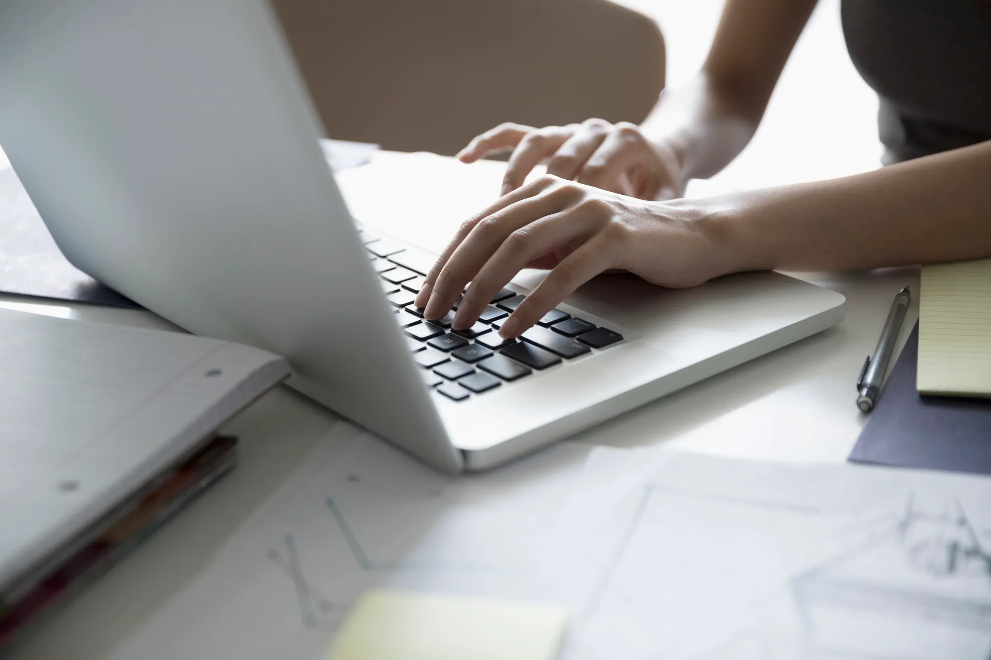 Female architect working at laptop