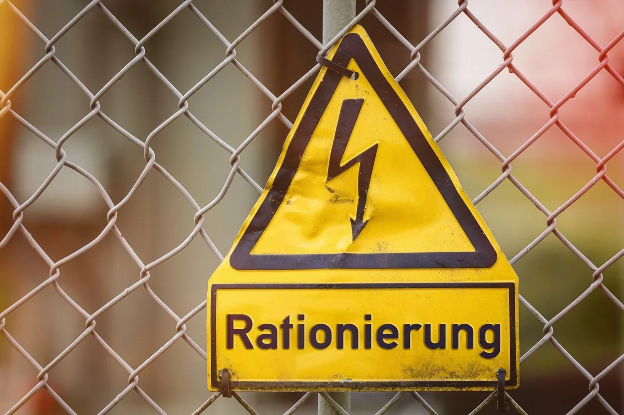High Voltage Sign On A Fence With The Inscription Electricity Rationing, Rationing And Allocating Electricity And Energy, Critical Energy Supply PHOTO