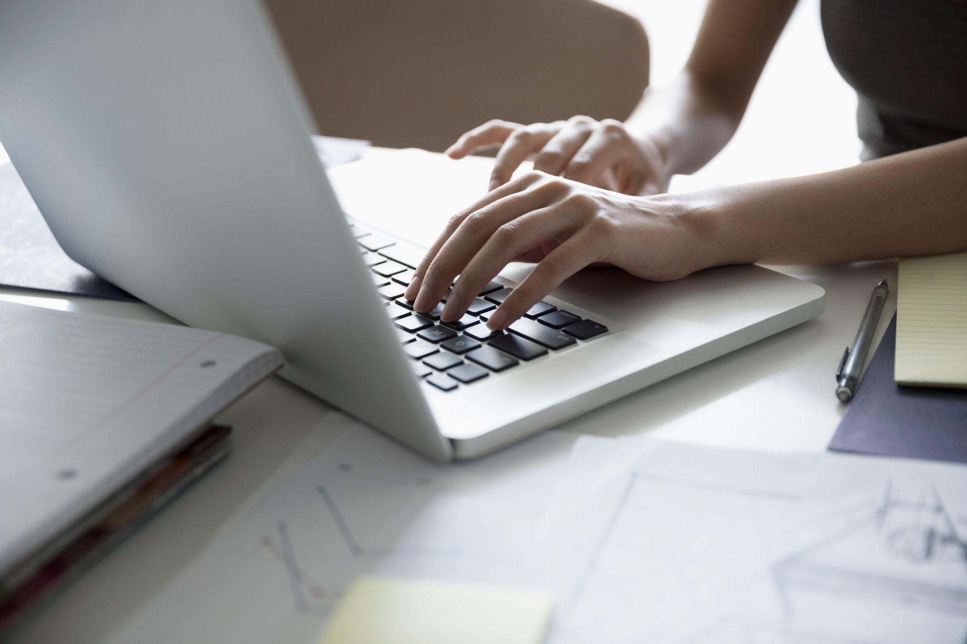Female architect working at laptop