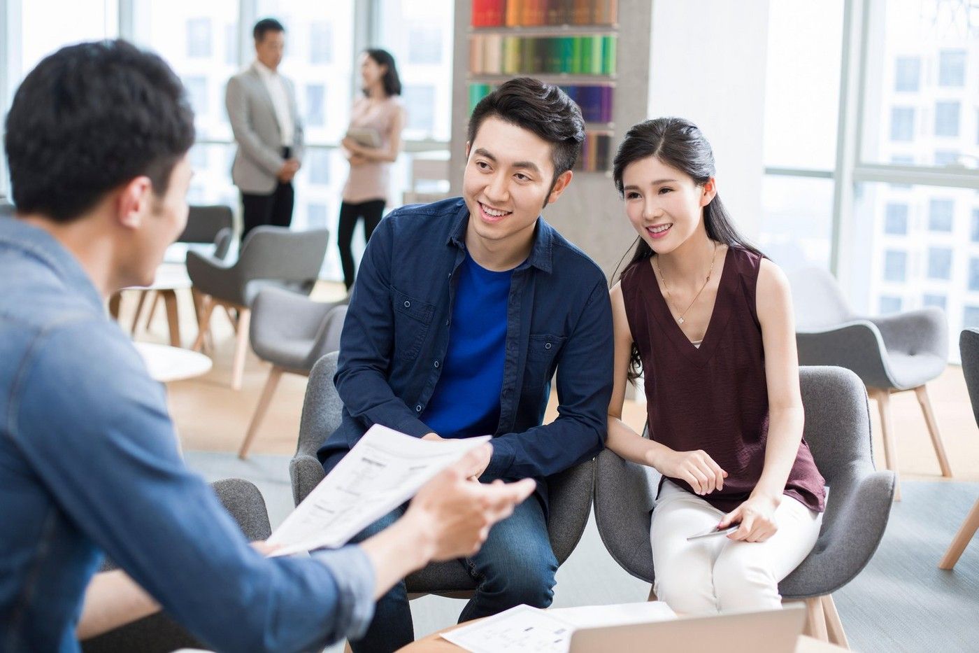 Chinese business people talking in meeting